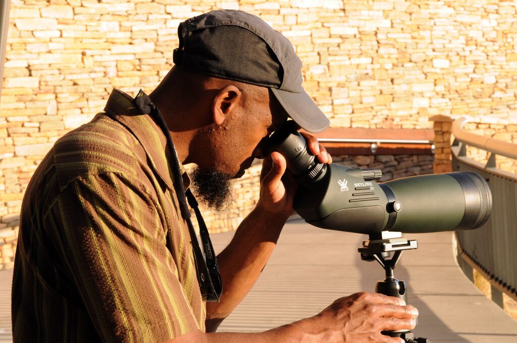 Birder using a spotting scope